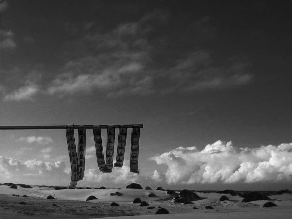 Black and white film strip installation in desert