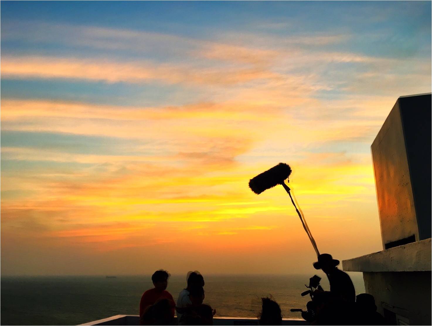 Production sound crew working during sunset